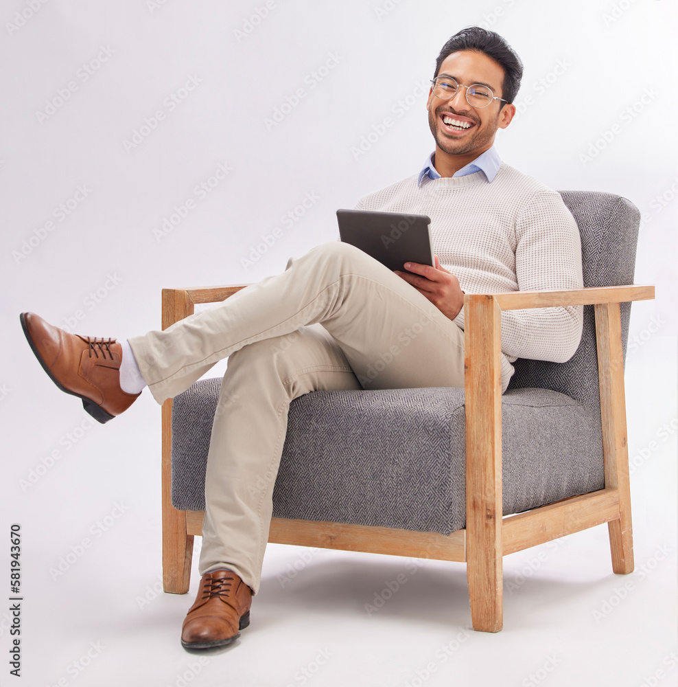 Business man on armchair isolated on a white background happy therapist portrait, career mindset and work on tablet. Asian professional person or psychologist relax on chair, digital tech and studio