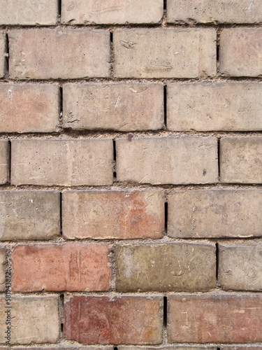 A fragment of the wall of a tenement house made of old bricks, Madrid, Spain.