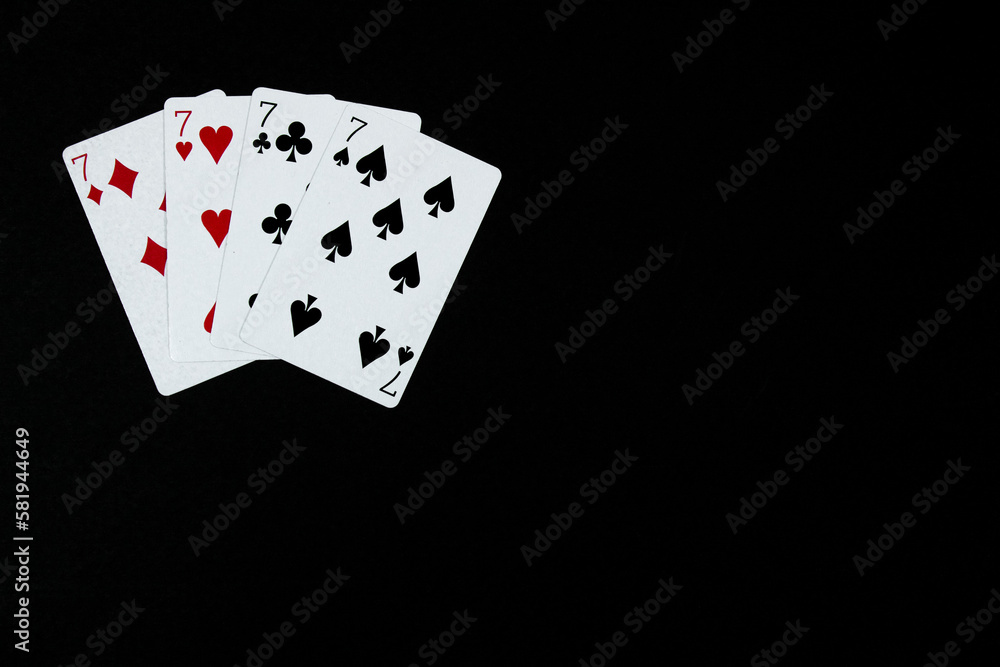 poker of seven in black background