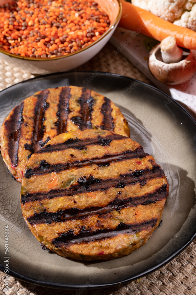 Barbecue grilled tasty vegan and vegetarian burgers made from fresh vegetables and dried legumes and beans