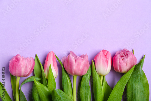 Fototapeta Naklejka Na Ścianę i Meble -  Composition with beautiful tulip flowers on lilac background, closeup. Mother's Day celebration