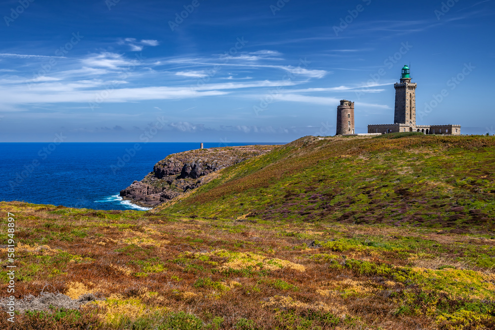 Cliffs At Atlantic Coast With Ancient Lighthouse At Cap Frehel In Brittany, France; Phare du Cap Frehel