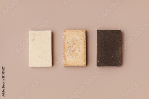 Set of natural soap bars on color background