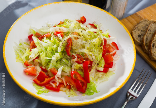 Light salad with fresh bell pepper, сhinese cabbage and onion