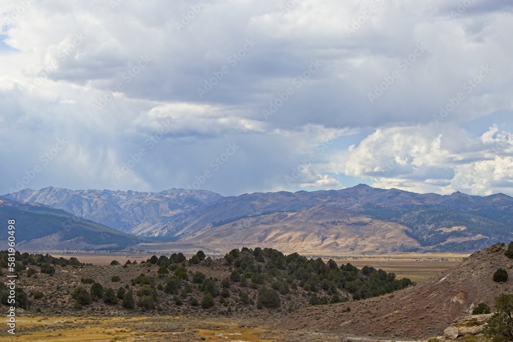 Fototapeta premium Sharp peaks rise over the Eastern Sierra, a region at the base of the steep eastern side of the Sierra Nevadas, as seen from the Travertine Hot Springs.