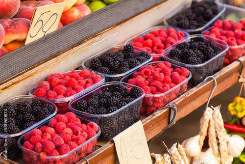 Display of a market stall with blackberries and raspberries