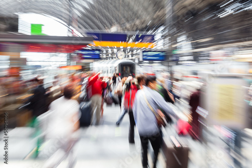 abstract blurred picture with a crowded scene at a train station