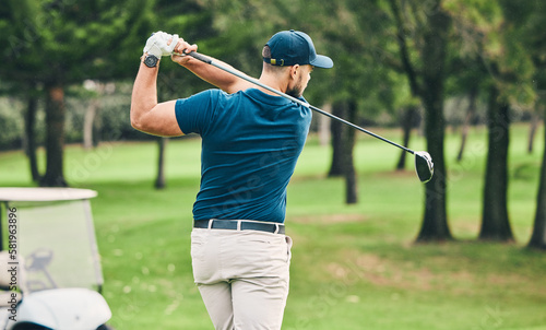 Golf, training and hobby with a sports man swinging a club on a field or course for recreation and fun. Golfing, grass and stroke with a male golfer playing a game on a green during summer