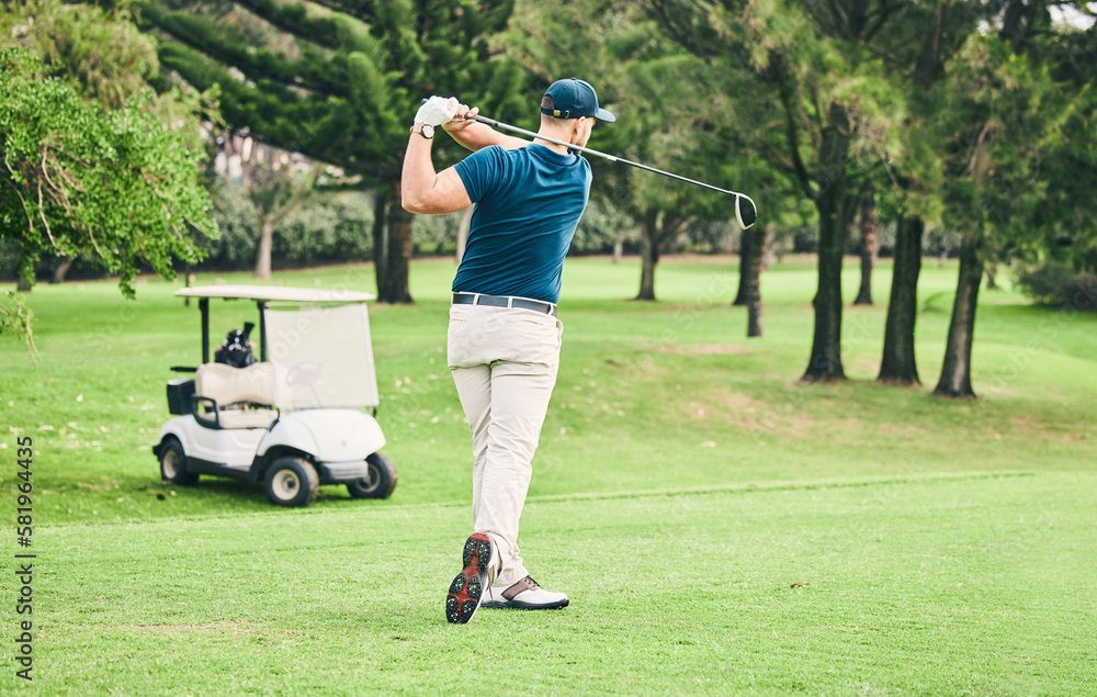 Fototapeta premium Golf, stroke and grass with a sports man swinging a club on a field or course for recreation and fun. Golfing, hobby and training with a male golfer playing a game on a green during summer