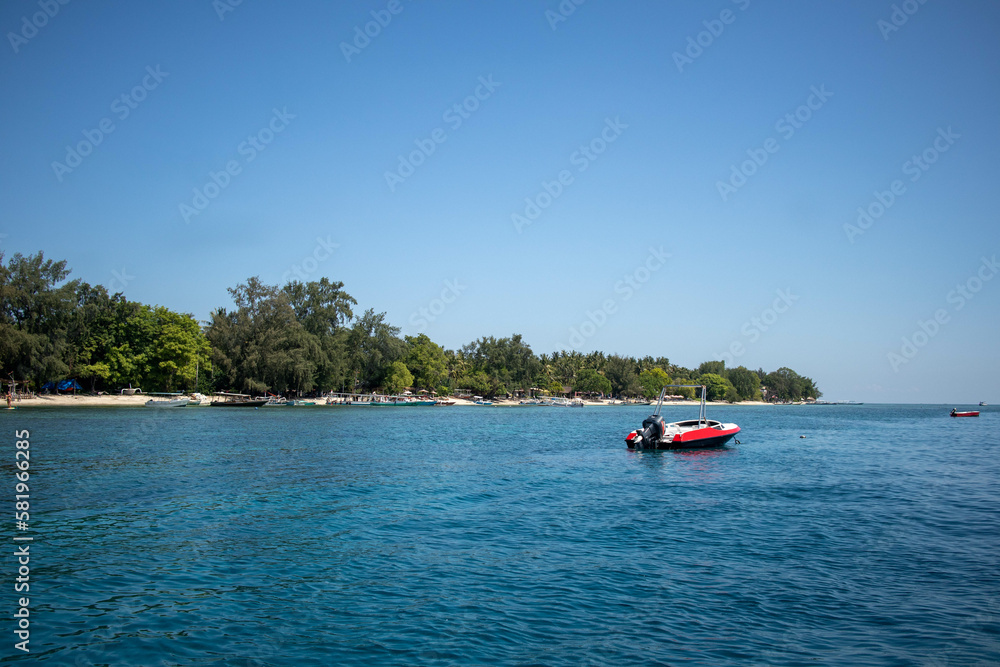 Speedboat and tropical shore on summer vacation paradise island, Indonesia