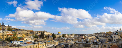 Panoramic skyline of Jerusalem Old City Arab quarter near Western Wall and Dome of the Rock.