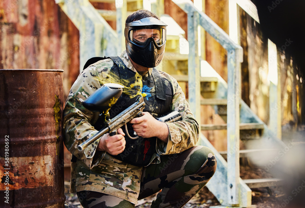 Paintball, portrait or male soldier with gun in shooting game playing on fun training battlefield mission. Man or focused warrior with army weapons gear for survival in military challenge competition Paintball, portrait or male soldier with gun in shooting game playing on fun training battlefield mission. Man or focused warrior with army weapons gear for survival in military challenge competition