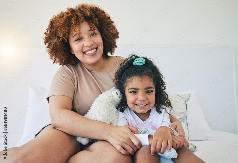 Mother, home and young girl portrait on a bed in the morning with toy in a family bedroom. House, smile and happy mom with a child with mama love and care for her kid with happiness while relaxing Mother, home and young girl portrait on a bed in the morning with toy in a family bedroom. House, smile and happy mom with a child with mama love and care for her kid with happiness while relaxing
