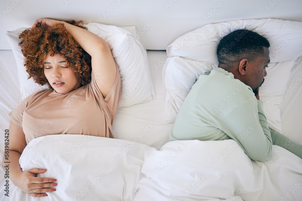 Top view, sleeping and black couple in bed in morning after fighting, argument and relationship problem. Depression, dating and male in bed with woman with sexual frustrated, infertility and stress Top view, sleeping and black couple in bed in morning after fighting, argument and relationship problem. Depression, dating and male in bed with woman with sexual frustrated, infertility and stress