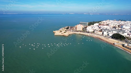 Wallpaper Mural Sailboats anchored on the coastline of the white city of Cadiz, Spain aerial view. Torontodigital.ca
