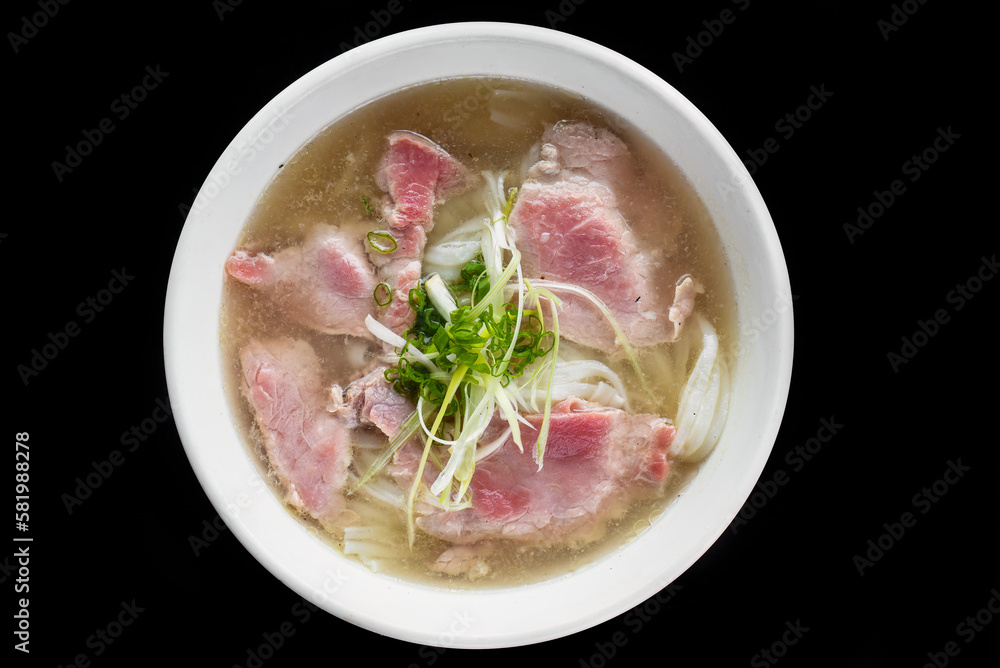 Traditional vietnamese soup Pho bo on black background Traditional vietnamese soup Pho bo on black background