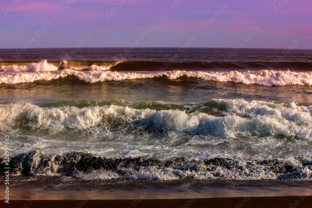 Waves in the Pacific Ocean near the coast of the Kamchatka Peninsula at sunset