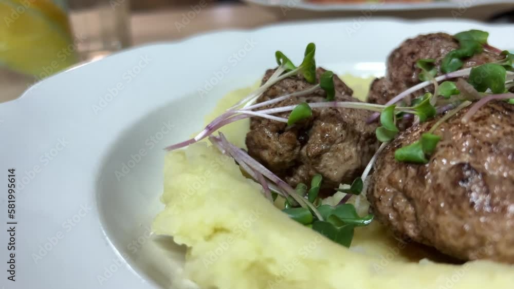 fillet of beef with mushrooms and mashed potatoes in a restaurant . High quality 4k footage fillet of beef with mushrooms and mashed potatoes in a restaurant . High quality 4k footage