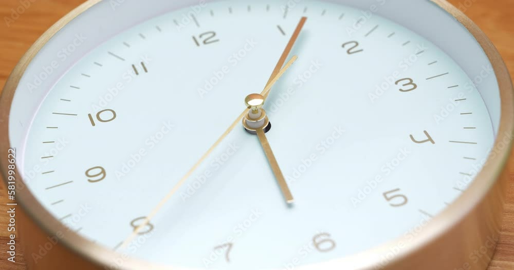 Clock ticking fast on a wooden table background video showing the movement of time each second 4k video. Clock ticking fast on a wooden table background video showing the movement of time each second 4k video.