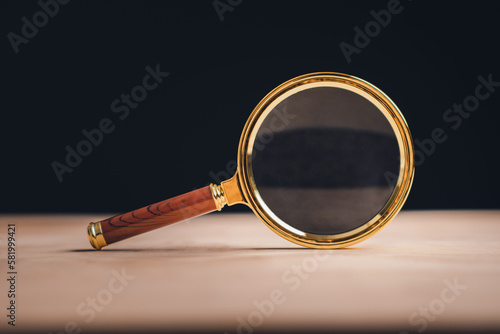 Magnifying glass on wooden table. CRM, Customer Relationship Management. HR, human resource search personnel. Job applicant.