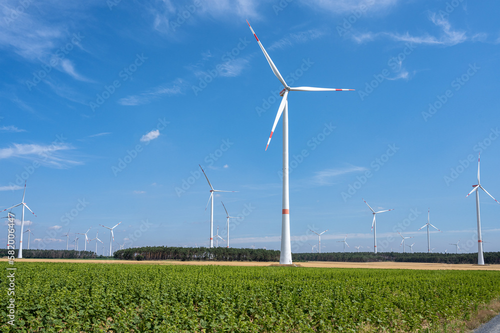 Modern wind energy turbines with a blue sky in Germany Modern wind energy turbines with a blue sky in Germany