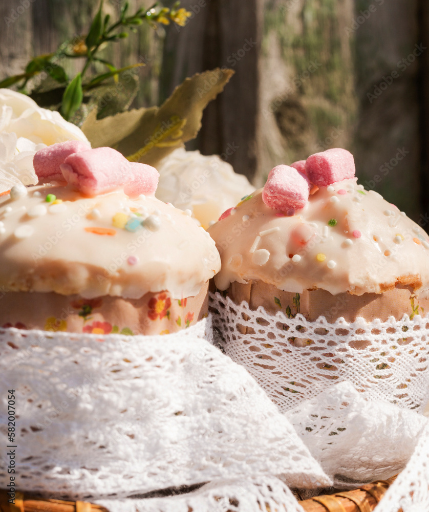 Small homemade cupcakes on the background of an old wooden background. Close-up. Selective focus. Vertical photo Small homemade cupcakes on the background of an old wooden background. Close-up. Selective focus. Vertical photo