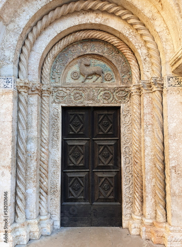 ornate church door entrance of St. Anastasia cathedral at Zadar, Croatia