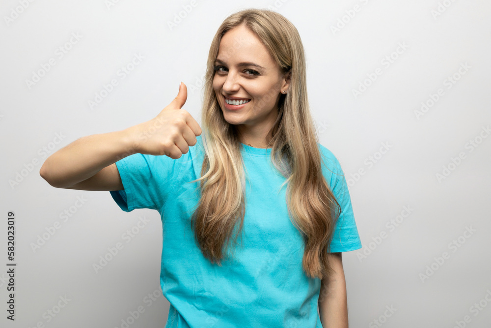 blond woman showing class with finger on white background blond woman showing class with finger on white background