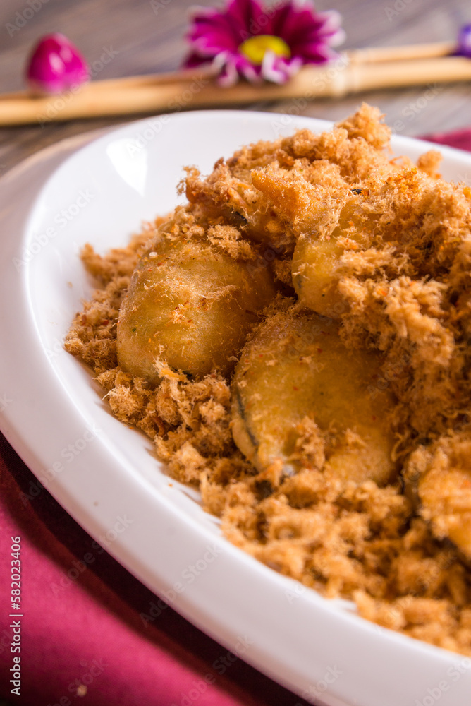 deep fried crispy eggplant vegetable and chicken floss with pepper mayonnaise sauce in white plate on red cloth wood table asian halal banquet appetiser snack menu 