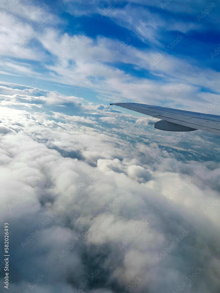 Fototapeta premium Сloudy sky from porthole
