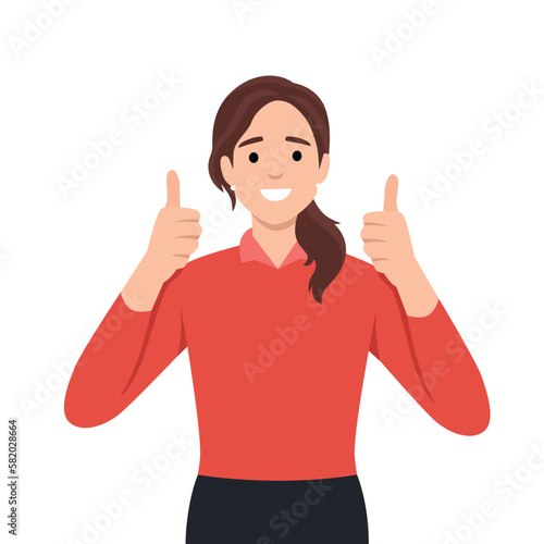 A beautiful woman shows a gesture of approval. Cool or Ok. Thumb lifted up