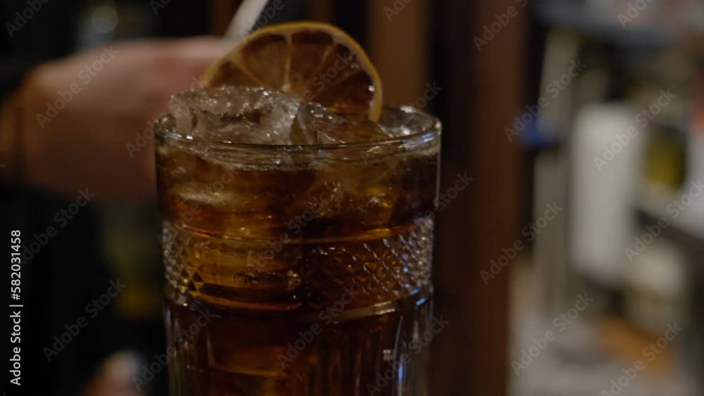 Closeup Of Cuba Libre Drink In Slow Motion. Rum And Coke Cocktail Closeup Of Cuba Libre Drink In Slow Motion. Rum And Coke Cocktail