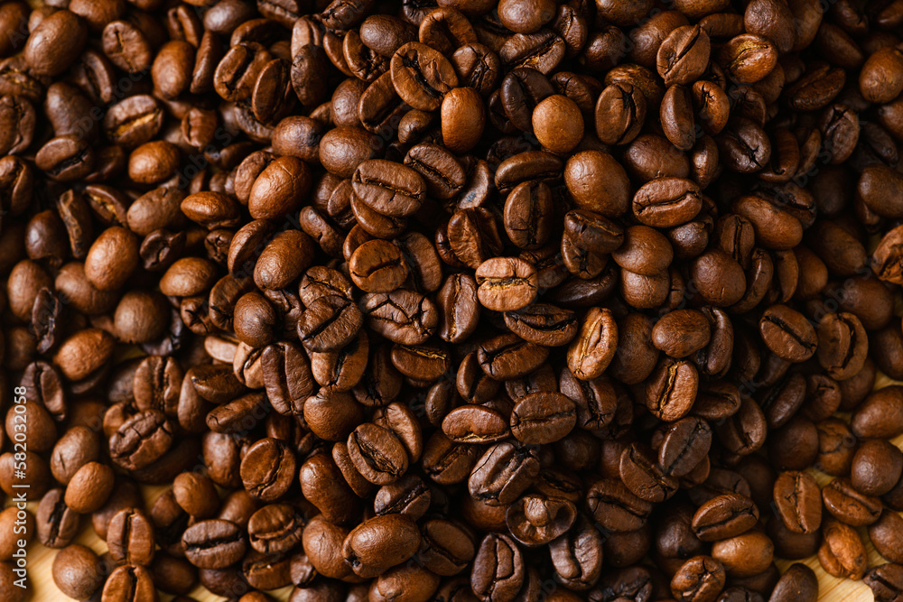 Roasted coffee beans background macro close-up, top view Roasted coffee beans background macro close-up, top view
