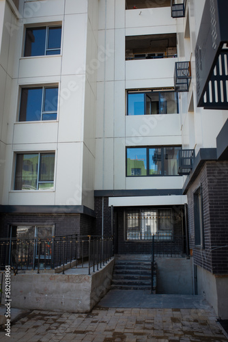 entrance of a new multi-storey building. construction of houses