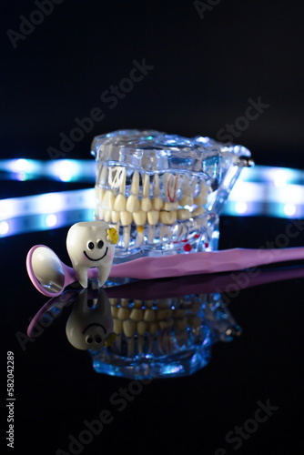 Dental jaw model over black background. Transparent invisible dental aligners or braces aplicable for an orthodontic dental treatment
