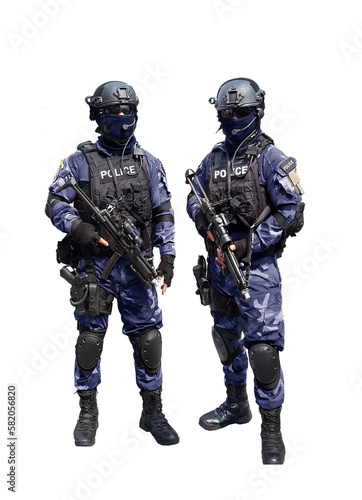 Police special unit standing arm with automatic weapon.