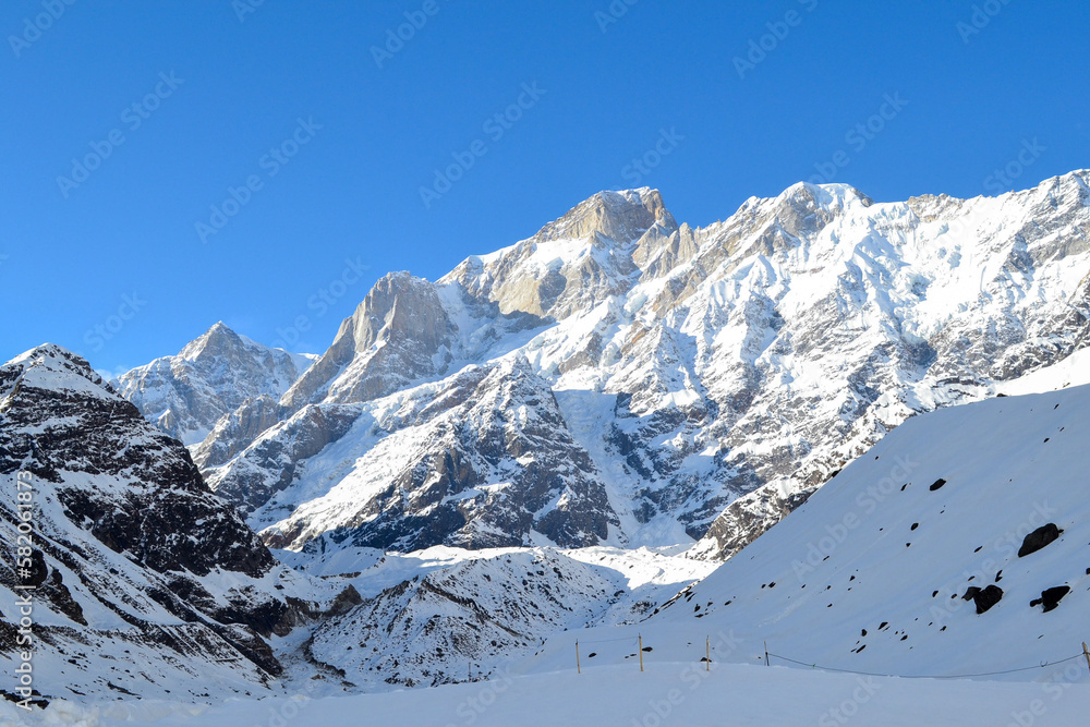 Snow-covered mountain peaks in Himalaya India. The Great Himalayas or Greater Himalayas probably is the highest mountain range of the Himalayan Range System. Snow-covered mountain peaks in Himalaya India. The Great Himalayas or Greater Himalayas probably is the highest mountain range of the Himalayan Range System.