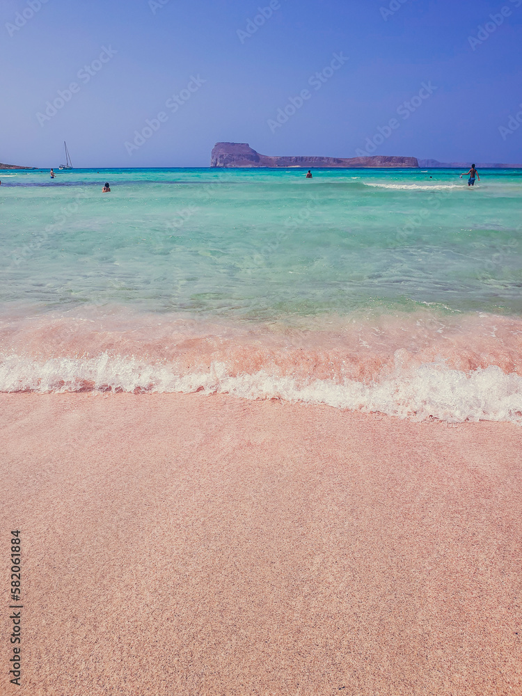 The pink sand and the turquoise water at the beach of Balos Lagoon, Crete island, Greece