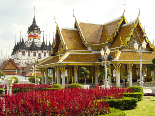 Golden Royal Pavilion and old Metal Castle buildings in background outdoor in Grand Palace in Bangkok - Thailand