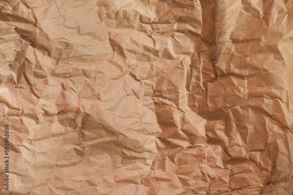 Background for design. Brown crumpled craft paper. The concept of using eco-friendly materials. Copy space Background for design. Brown crumpled craft paper. The concept of using eco-friendly materials. Copy space