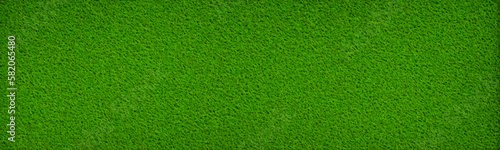 Abstract astroturf pattern in green texture for artificial soccer or football fields. Fake grass is perfect for indoor and outdoor exercise. Vector photo