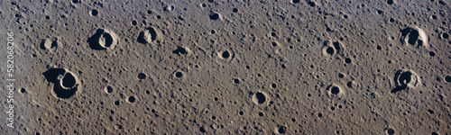 Closeup of lunar surface with textured moon background and iconic apollo 11 footprint. Historical image evokes outer space exploration and mankind's achievements. Vector photo