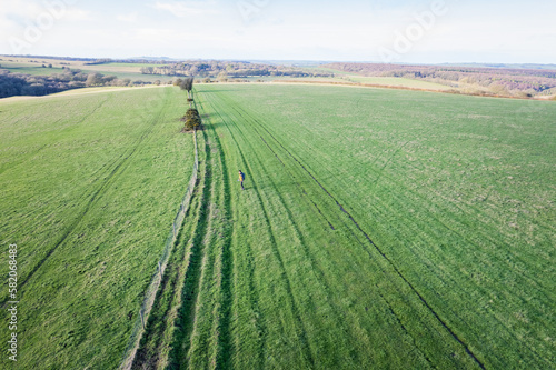 beautiful countryside in Pewsey  Wiltshire. Backpacker walking in footpath outdoor