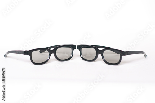 two glasses for watching stereo movies. on a white background. front view. selective focus on the middle of the frames
