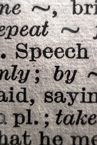 Definition of word speech on dictionary page, close-up
