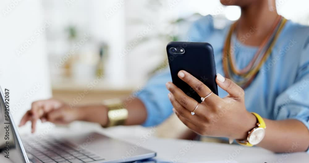 Phone, laptop and hands typing in office for research, planning or social media. Technology, cellphone and black woman with smartphone for business networking, internet browsing and web scrolling. Phone, laptop and hands typing in office for research, planning or social media. Technology, cellphone and black woman with smartphone for business networking, internet browsing and web scrolling.