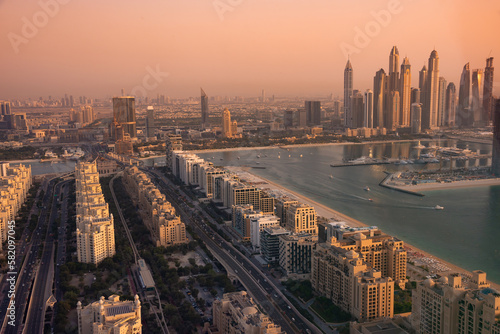Dubai skyline on sunset  modern city with skyscrapers