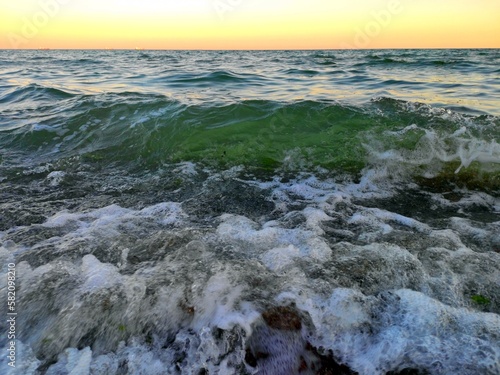 Waves crash against the Black Sea coast on a beach in the Odesa region. August, 2020