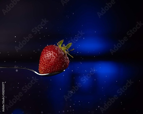 strawberry falling into water
