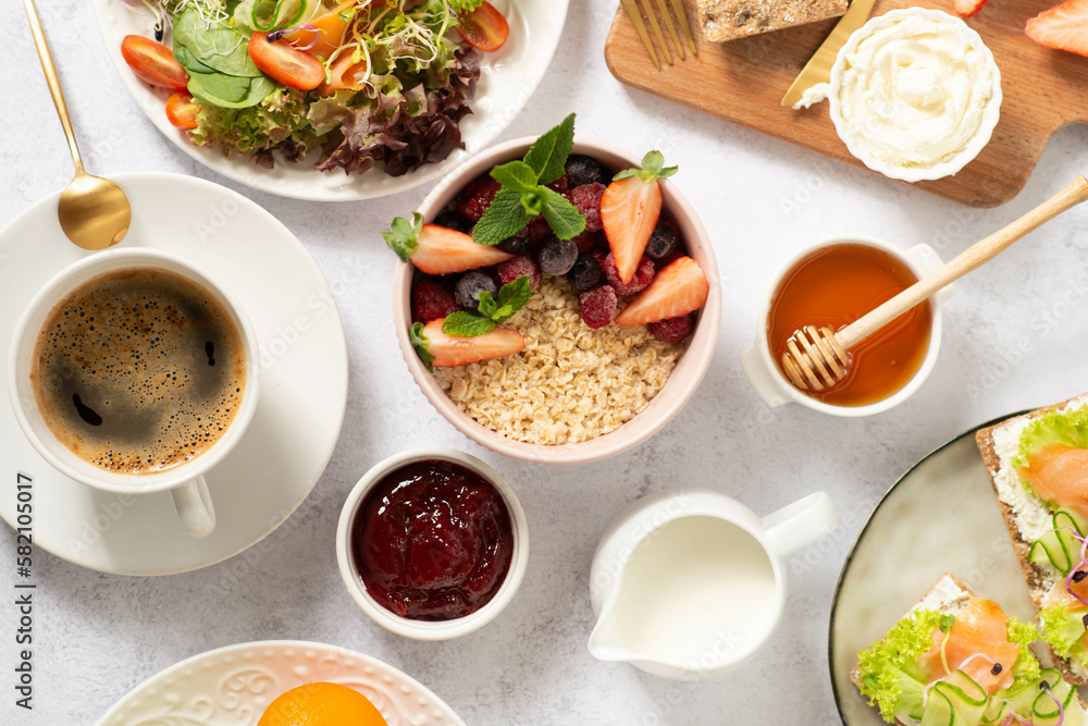 Healthy breakfast set on grey background. The concept of delicious and healthy food. Healthy breakfast set on grey background. The concept of delicious and healthy food.